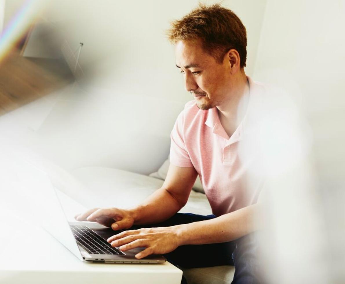 image of man sitting at desk