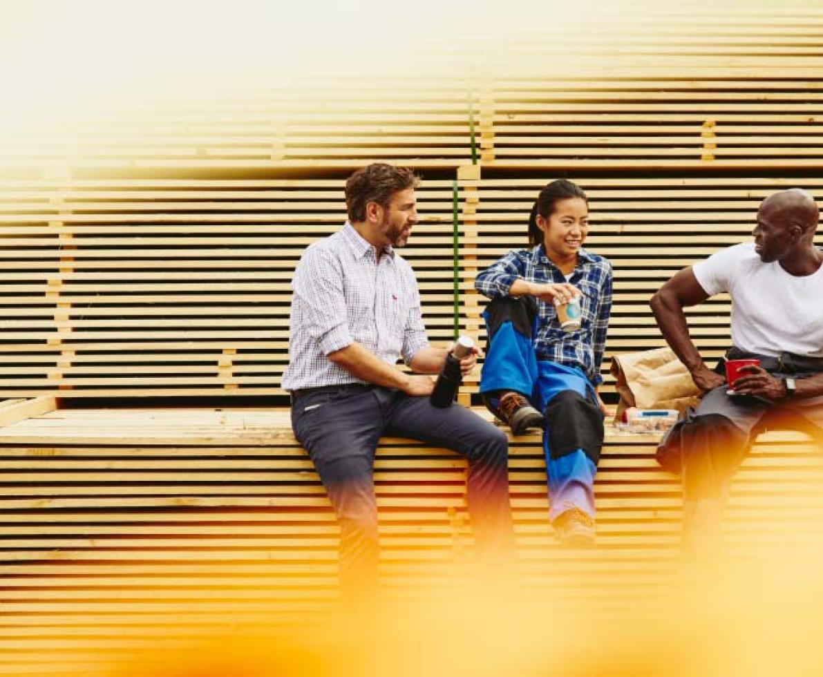 image of 2 men and a woman having a lunch break