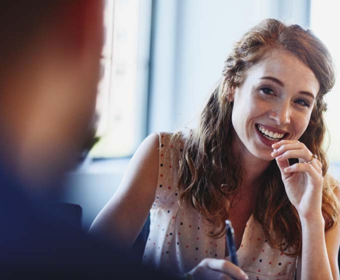 image of woman with red hair smiling