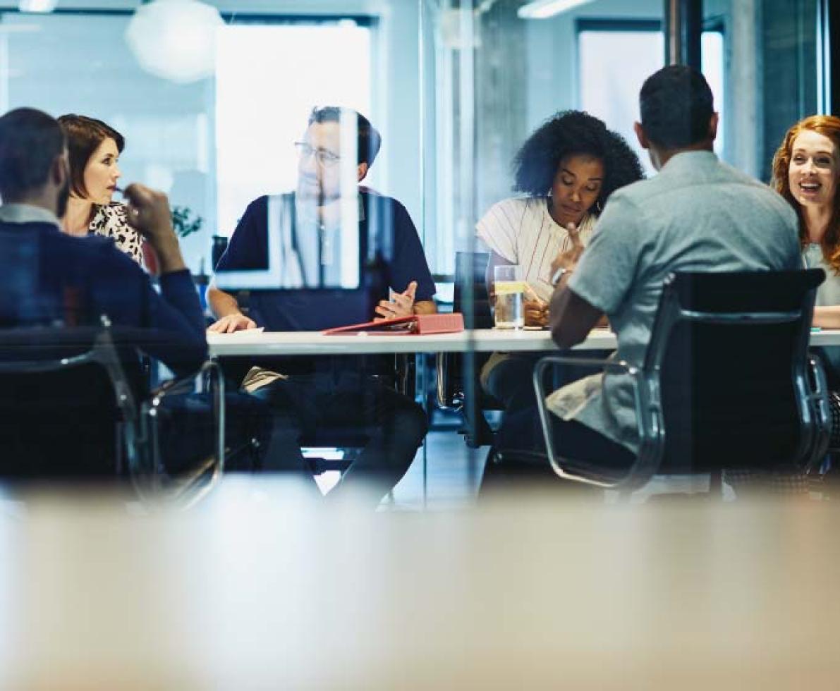 people sitting in a boardroom having a meeting