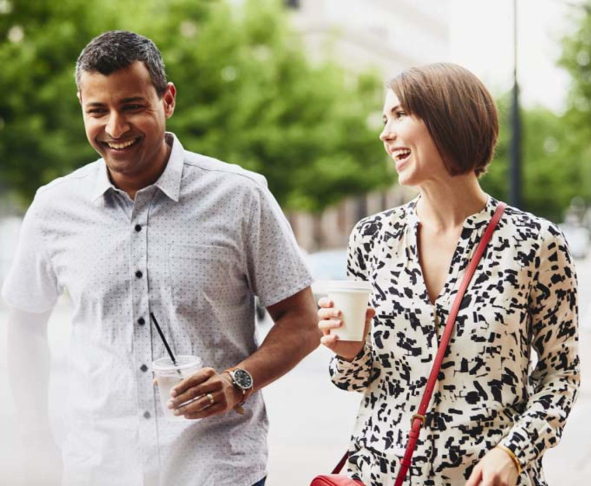 a man and woman walking and talking